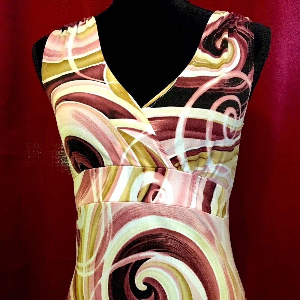 Vintage Y2K Sophisticated sleeveless top with swirly, colorful designs. Medium